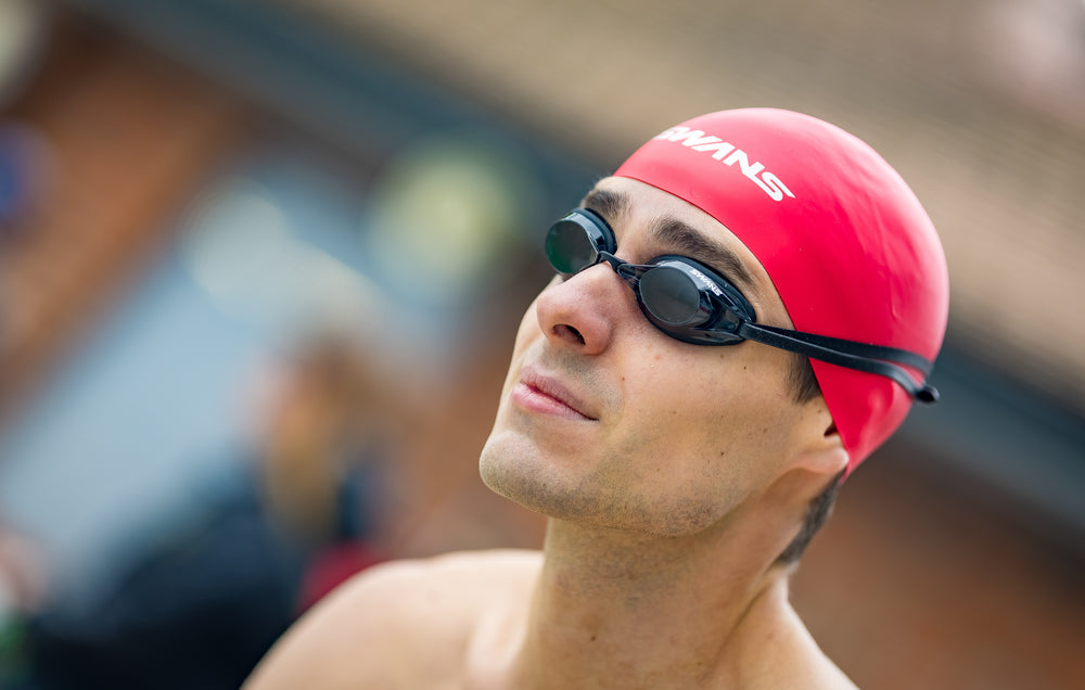 Black swim goggles with smoke lenses