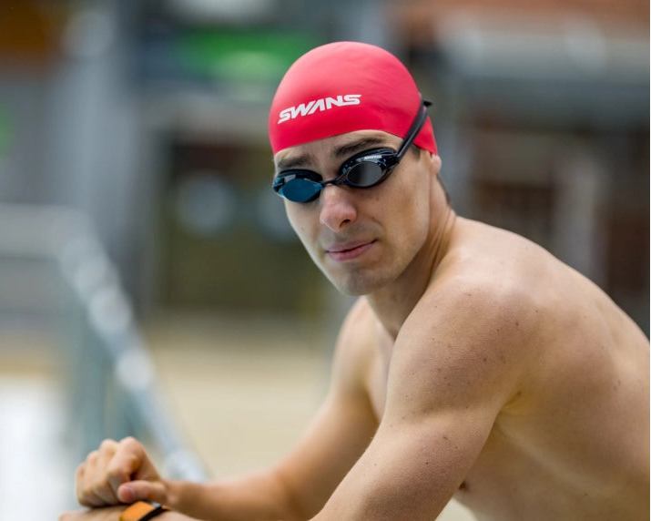 Black swim goggles with smoke lenses